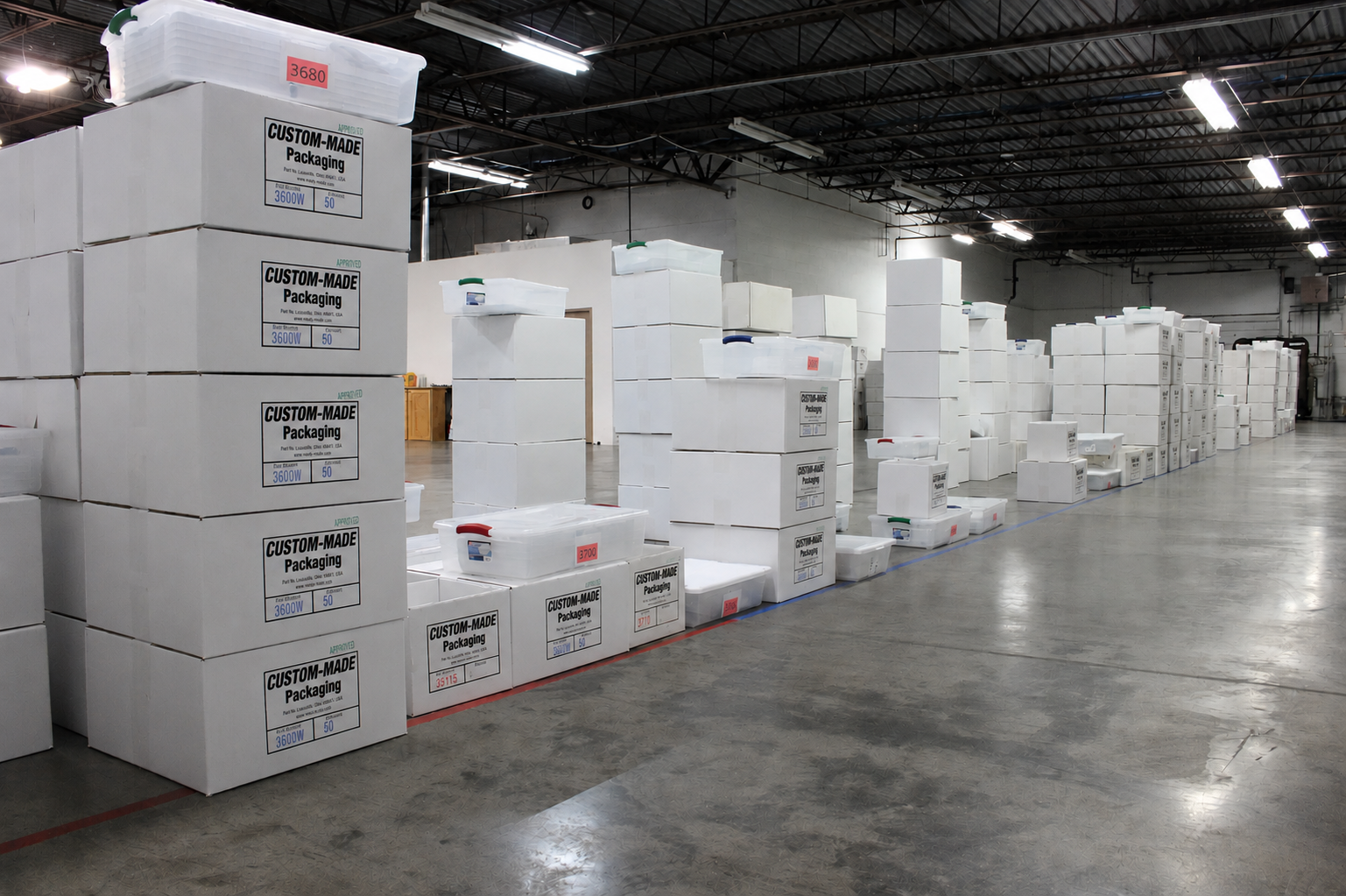 Stacked shipping boxes of thermoformed packaging in warehouse